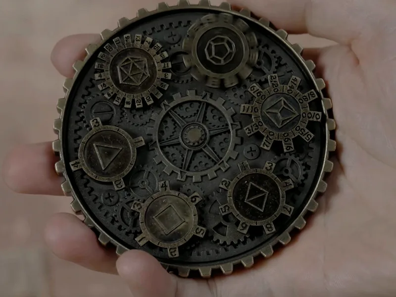 The wheel held in a palm, all six polyhedral dials facing up