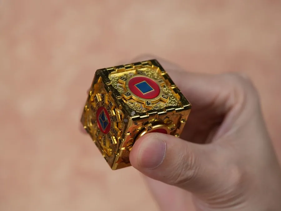 Cube Edition held between fingers